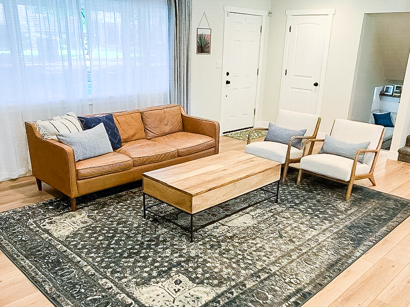 Beautiful living room with Calypso Oak LVP flooring | PFC