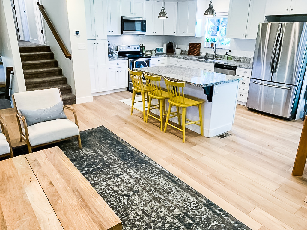 Light, bright kitchen with COREtec's Calypso Oak luxury vinyl plank | PFC